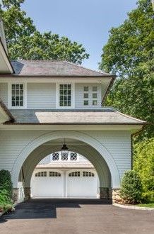 a large white house with an arched entrance