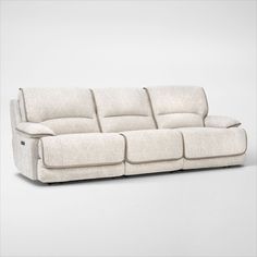 the reclining sofa is made from fabric and has two seats on each side, one with