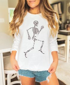 This Skeleton Anatomy Sweatshirt is perfect for a Science teacher, Biology teacher, or Anatomy teacher to wear on Halloween. This shirt can also be worn by a Doctor, Biology student, a Pre-med student, or anyone who likes science. The names of the bones are spelled out within the Skelton's image. This shirt can also be worn on days other than Halloween, such as when teaching the bones of the human skeleton in anatomy class.  Ideal for any situation, a unisex heavy blend crewneck sweatshirt is pure comfort. These garments are made from polyester and cotton. This combination helps designs come out looking fresh and beautiful. The collar is ribbed knit, so it retains its shape even after washing. There are no itchy side seams on these sweaters.  50% cotton, 50% polyester Medium-heavy fabric ( Stretch Long Sleeve Halloween Tops, Stretch Skull Print Tops For Fall, White Long Sleeve Top With Skull Print, Spooky Skull Print Top For Fall, Spooky Skull Print Tops For Fall, Spooky Skull Print Fall Top, Fall Skull Print Crew Neck Top, Fall Skull Print Long Sleeve T-shirt, Long Sleeve Skull Print T-shirt For Fall