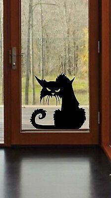 an open door with a silhouette of a cat on it