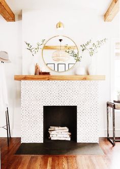 a fireplace with a mirror above it that says super modern surround w / white oak mantle