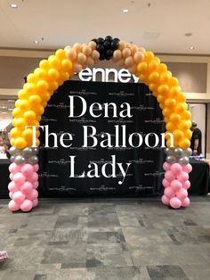 an entrance to a balloon lady event with balloons in the shape of arch and name sign