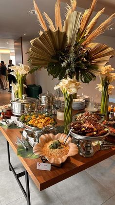 a buffet table filled with lots of food