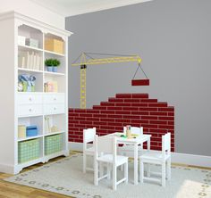 a room with a table, chairs and a wall mounted crane in the middle of it