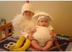 two children dressed up in costumes sitting on a bed with bananas and banana peels