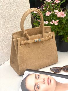 Our Jute bags are Carefully handcrafted from  sustainable natural jute material. This beautiful bags  are excellent option and eco-friendly choice for your sustainable lifestyle. With natural color hue this Bag Will fit with any occasion And Very versatile Features: * Dimensions: 30 cm  (Width) x 25cm (Height) * Woven from 100% recycled jute yarn * Inner lining made from Linen * Includes one inside pocket * Include Bag flap lid Include detachable & Adjustable long strap Please attache your Phone Number for shipping information (DHL Express requirement) Wholesale welcome Natural Woven Burlap Bags, Natural Burlap Woven Bags, Eco-friendly Burlap Tote Straw Bag, Eco-friendly Burlap Straw Tote Bag, Everyday Beige Burlap Bag, Everyday Beige Burlap Bags, Eco-friendly Natural Color Gift Bag, Eco-friendly Beige Burlap Straw Bag, Eco-friendly Jute Shoulder Bag For Daily Use