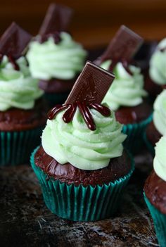 cupcakes with green frosting and chocolate decorations