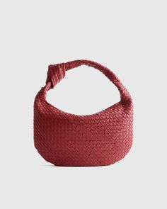 This Italian Leather Handwoven Slouchy Shoulder Bag is the epitome of luxury and style. Handcrafted from the finest Italian leather, this bag features a clean handwoven design that adds a touch of sophistication to any outfit. The slouchy silhouette gives it a relaxed and effortless vibe, perfect for everyday use or special occasions. With ample space and two pockets for all your essentials, this shoulder bag is both practical and chic. Make a statement with this versatile piece that will elevat Luxury Braided Bags For Everyday Use, Formal Brown Woven Bag, Formal Brown Woven Bags, Leather Braided Shopping Bag, Leather Top Handle Bag With Braided Details, Leather Braided Bag For Shopping, Modern Red Bags With Braided Handles, Red Evening Bag With Intrecciato Weave, Red Top Handle Bag With Intrecciato Weave