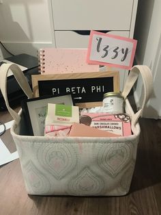 a basket filled with personal items on top of a wooden floor