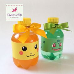 two plastic bottles with different designs on them, one has a yellow bow and the other is green