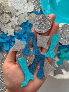 someone is holding up some glitter stars in their hand with the words pants - royal blue