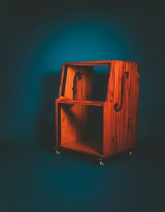 a wooden shelf sitting on top of a blue wall