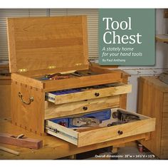 an open tool chest sitting on top of a wooden table