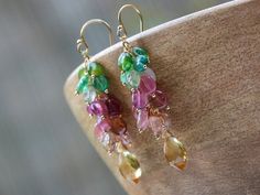 THE JEWELRY IS SHIPPED via DHL EXPRESS (4-5 days delivery door to door). THE DHL SHIPPING COST IS INCLUDED IN THE PRICE. PLEASE LEAVE YOUR PHONE NUMBER UPON CHECKOUT IN THE NOTES OR MESSAGE IT TO ME. The Sunblink Earrings - Pink and Green Tourmaline Dangle Earrings with Citrine Briolettes► Measurements / Details:- Length including earwire: 2" (~5.1 cm)- Gold: High quality 14K Gold Filled- Silver: High Quality Sterling Silver► Gemstones:The earrings include excellent AAA quality gemstones, they a Gold Dangle Gemstones Fine Jewelry, Fine Jewelry Gold Dangle Gemstones, Gold Multi-stone Dangle Gemstones, Bracelet Mexican, Citrine Bracelet, Mexican Fire Opal, Tourmaline Earrings, Citrine Earrings, Yellow Gemstones