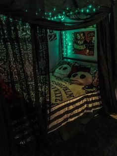 a bed with lights on it in a room that looks like someone's bedroom