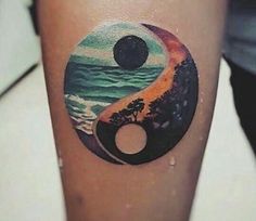 an image of a tattoo on someone's leg with the yin symbol painted on it