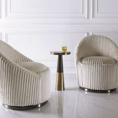 two white chairs sitting next to each other on top of a marble floor covered floor