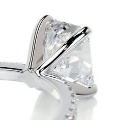 This is why radiant cuts are so popular! They give the most modern twist to classic rectangular cuts.Here is our 2.3-ctw radiant F VS2 engagement ring finished with a band of icy white diamonds.This has her name all over it.2 Carat Radiant F VS2 Diamond with an additional of 0.3 Carat Diamonds on the sides. This Ring is Certified by a Third Party Gemological institute