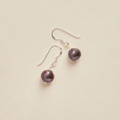 These cute dark purple Fresh water Pearl earrings are made with durable 925 sterling silver. Dimensions: Total length: 27mm Total width: 9mm - Please note - * Additional photos or videos available on request * Go to 'About us' section to find links to our social and website * All stones have been carefully hand picked and paired for earrings. Keep in mind that each pair of earrings is composed of two different genuine stones which means they can slightly differ in appearance. We believe that thi Purple Pearl Earrings For Pierced Ears As A Gift, Purple Pearl Earrings Gift, Purple Pearl Earrings As Gift, Purple Pearl Earrings For Gift, Formal Purple Pearl Drop Earrings, Everyday Hypoallergenic Purple Earrings, Purple Round Pearl Earrings For Gift, Everyday Purple Jewelry With Ear Wire, Elegant Purple Earrings For Everyday