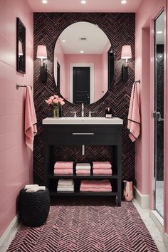 a bathroom with pink walls and black vanity, mirror, and rugs on the floor