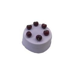 a white cake topped with cherries on top of a white table covered in frosting