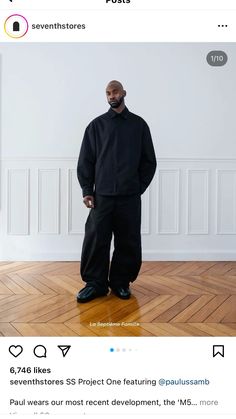 a man standing on top of a hard wood floor