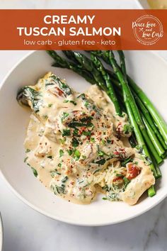 creamy tuscann salmon pasta with asparagus on a white plate, ready to be eaten