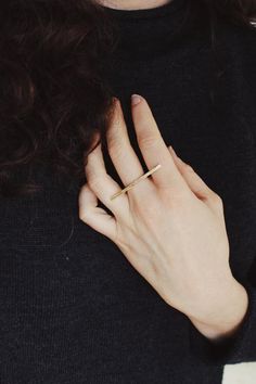 Subtle yet powerful, this ring is a favorite. An elegant yet easy piece for versatile wear, this ring is comfortable and delicate while remaining sturdy and bold looking. A hand shaped brass bar lays partly across three fingers wile a sterling band secures it in place. The ring looks great on its own or paired with stackers. The bar measures about 40 mm across.Choose a plain finish or stamped brass bar.This piece is made to order in your size, please allow 2-3 weeks to create before shipping (ti Modern Brass Midi Rings, Everyday Brass Midi Rings, Minimalist Everyday Stackable Brass Rings, Minimalist Brass Midi Rings For Everyday Wear, Everyday Brass Midi Rings With Open Design, Brass Midi Rings For Everyday, Minimalist Brass Midi Rings For Everyday, Everyday Minimalist Brass Midi Rings, Everyday Brass Open Midi Rings