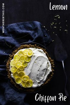 a lemon pie with whipped cream and sliced lemons