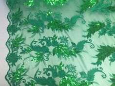 green sequin lace with flowers and leaves