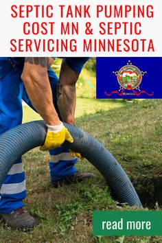 a man in blue pants and yellow gloves is using a hose to clean the grass