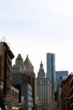 a city street filled with lots of tall buildings