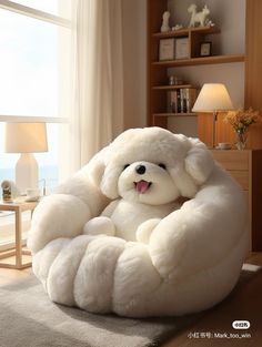 a large white stuffed animal sitting on top of a bed