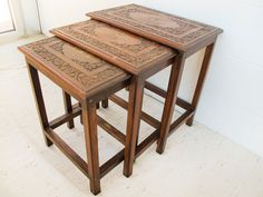 two wooden tables sitting next to each other