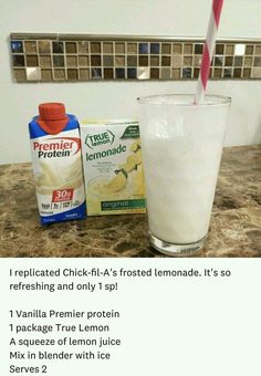 the ingredients to make a lemonade smoothie are displayed on a counter top with a red and white striped straw