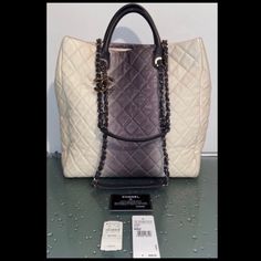 Authentic Chanel Rare Ombre Large Quilted Ivory Gray Silver Chain Tote Handbag. Originally Purchased In Neiman Marcus Boca Raton, Florida $3,600; Comes With Original Price Tags & Authenticity Card Matching The Inside Hologram; Condition Is "Excellent Pre-Owned"; Very Clean With Only Light Signs Of Preloved; Handles Look Brand New From A Nonsmoking Home Luxury Gray Shoulder Bag, Luxury White Bags With Chain Strap, Luxury Gray Evening Bag, Gray Luxury Shoulder Bag For Evening, Chanel Cerf Tote, Chanel Grand Shopping Tote, Chanel Canvas, La Girls, Chanel Tote Bag