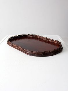 a wooden tray sitting on top of a white table