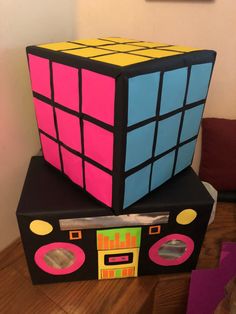 two rubik cubes stacked on top of each other in the shape of a radio