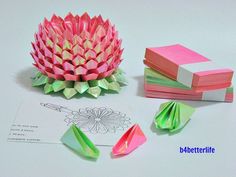 some origami flowers and other items on a table