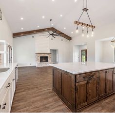 a large kitchen with an island in the middle