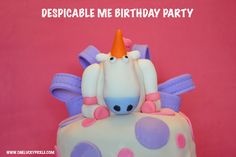 a birthday cake with an unicorn on top