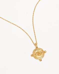 Embrace the unpredictability of the universe with our delicate 18k Gold Vermeil Luck and Love Necklace, a powerful symbol of luck and protection. Featuring the ancient evil eye motif, this elegant necklace boasts a radiant, battered pendant suspended on our signature chain. Let the gaze of the evil eye safeguard you from harm. Available in 18k gold vermeil Necklace length: 18 inches. Adjustable to 16 or 15 inches. Pendant: 13mm approx. Reversible pendant with a battered finish. Set on our signature fine chain. Engraved with the words “Luck and Love” on the back. Golden Compass, Symbol Of Luck, Eye Motif, Candle Matches, Elegant Necklace, Elegant Necklaces, Love Necklace, Perfect Ring, Diamond Stone