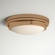 a close up of a light fixture on a white wall with no one in it