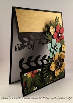 a close up of a greeting card with flowers on the front and bottom half of it