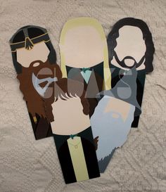 paper cut out of people with beards and mustaches