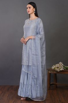 Look your best on festive occasions in this elegant doctor blue embroidered silk sharara suit. It comes with a matching dupatta. Shop online from Pure Elegance. Disclaimer: The actual product may vary slightly from the image. These are custom orders, hence expect slight variation in color, placement of the motif or buta. ESTIMATED DELIVERYBecause this is a custom order, it would take about 4 weeks from the date of purchase. RETURN POLICYThis product is a custom order and cannot be returned or exchanged. Blue Dola Silk Palazzo Set With Straight Kurta, Designer Blue Dola Silk Palazzo Set, Blue Chanderi Floor-length Palazzo Set, Blue Anarkali Raw Silk Palazzo Set, Blue Anarkali Style Raw Silk Palazzo Set, Unstitched Blue Sharara With Gota Work, Blue Anarkali Dola Silk Palazzo Set, Blue Anarkali Style Dola Silk Palazzo Set, Eid Blue Dola Silk Palazzo Set