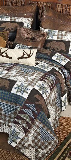 a bed with a deer head quilt on it