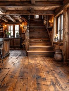 an old log cabin with wooden floors and stairs