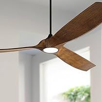 a ceiling fan in a living room with white walls and wood accents on the ceiling