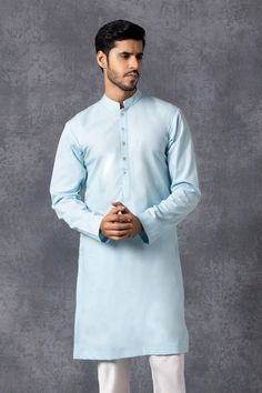 Powder blue kurta with front button placket. Paired with churidar.
Components: 2
Fabric: Cotton
Neckline: Mandarin
Sleeve Length: Full
Color: Blue
Mother of pearl buttons - Aza Fashions Blue Lawn Suit With Naqshi For Diwali, Light Blue Straight Kurta For Diwali, Blue Naqshi Straight Kurta Traditional Wear, Traditional Long Sleeve Light Blue Kurta, Light Blue Long Sleeve Kurta With Dabka, Traditional Light Blue Dabka Kurta, Festive Blue Churidar With Naqshi Detail, Blue Cotton Bandhgala For Eid, Light Blue Dabka Embellished Long Sleeve Kurta